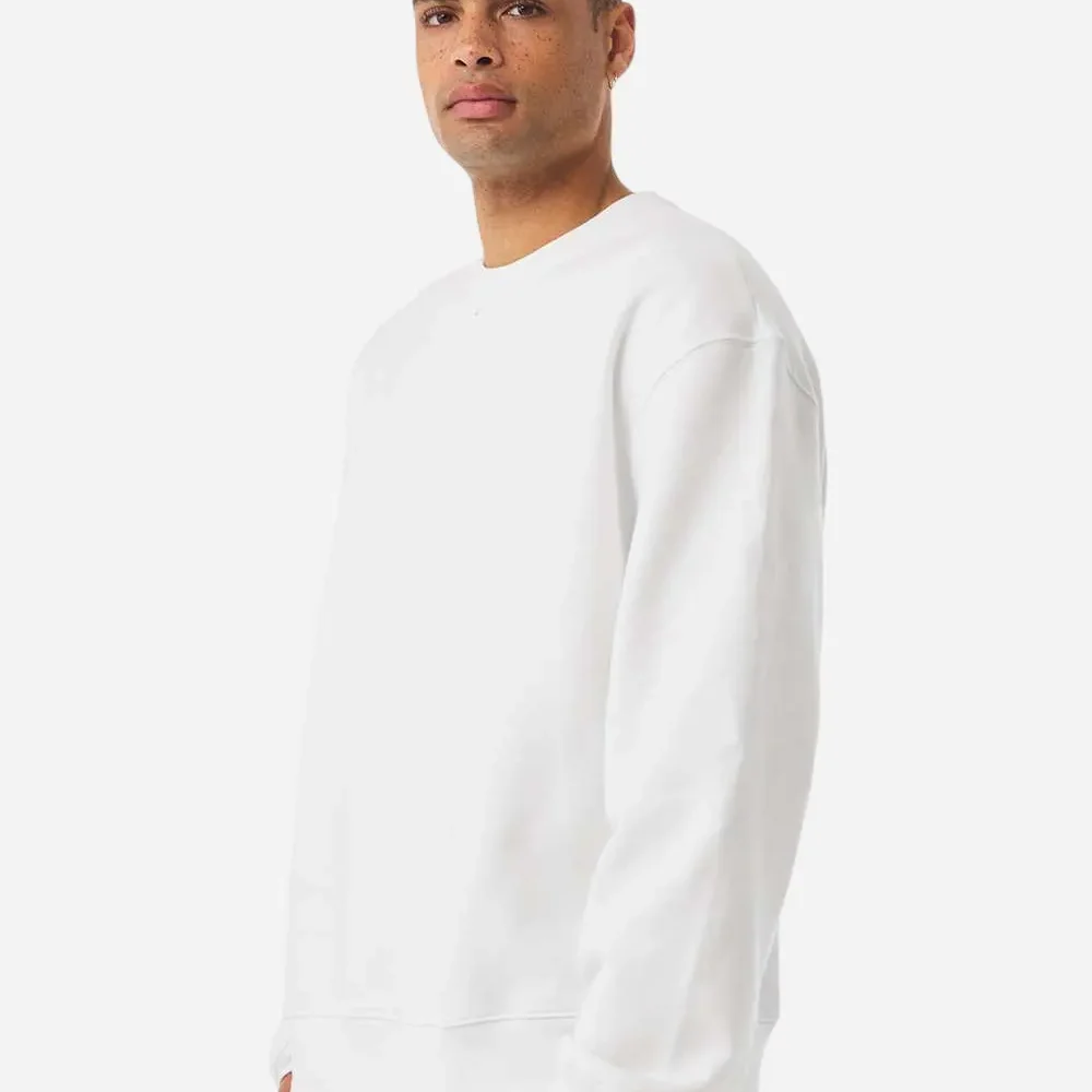 Man wearing a white crewneck sweatshirt and blue jeans.