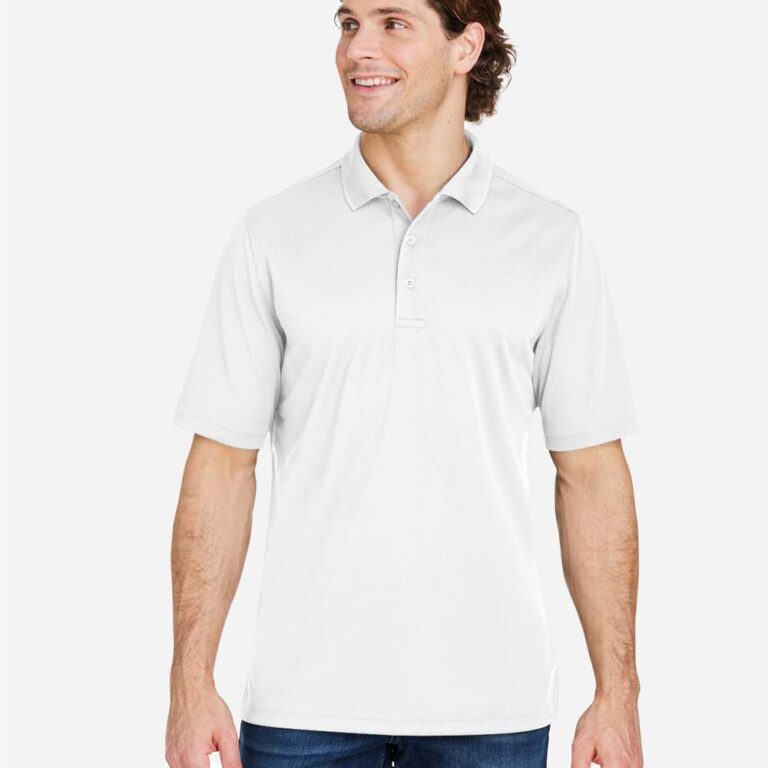 Man in white short-sleeve polo shirt and blue jeans smiles and looks to the side