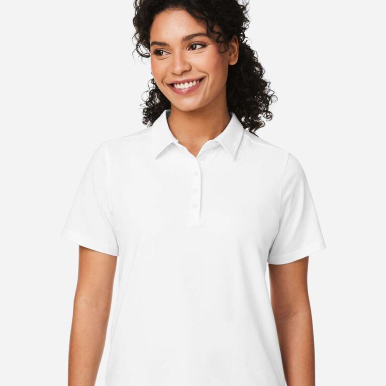 Smiling woman wearing a white short-sleeved polo shirt