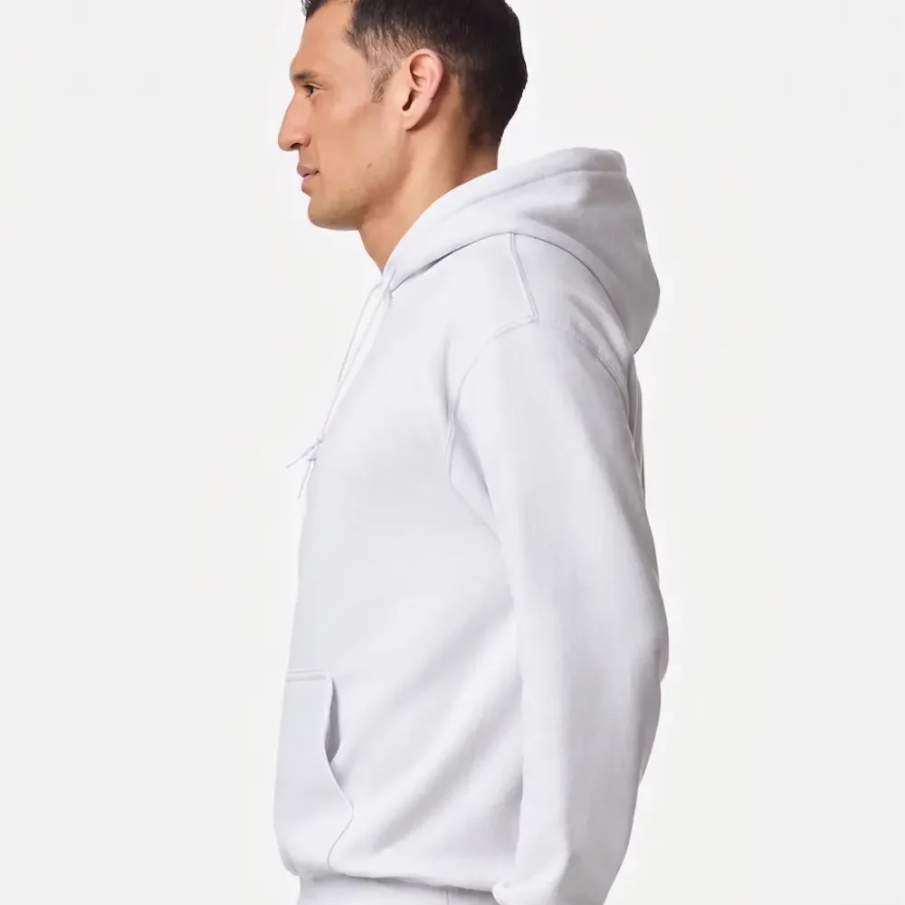 Man in white hoodie and blue jeans, profile view