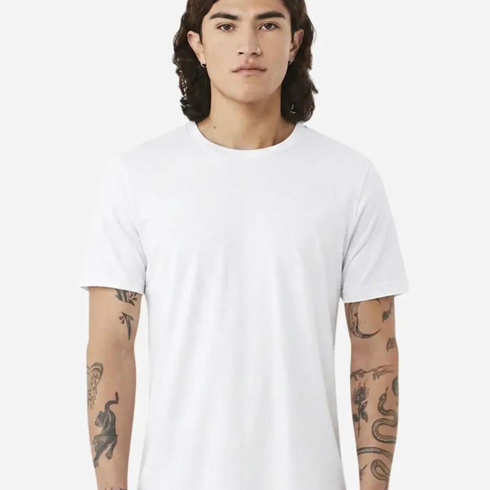 Man wearing a plain white t-shirt with elaborate arm tattoos.