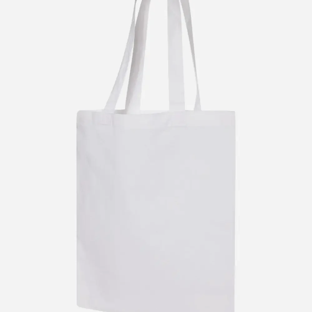 Plain white canvas tote bag with shoulder straps