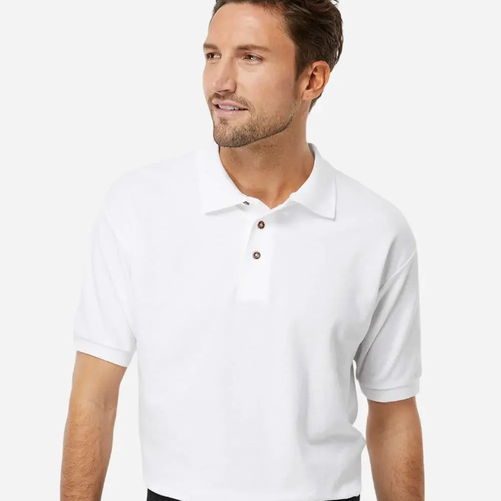 Man in white short sleeve polo shirt with two brown buttons and black belt