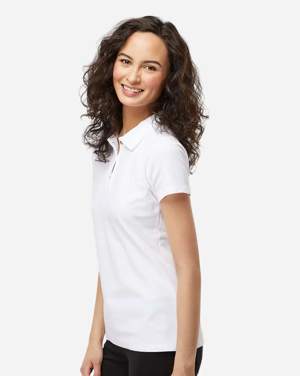 Woman smiling in a white short-sleeve polo shirt