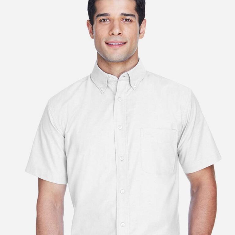 Man wearing a white short-sleeved button-up shirt with a chest pocket