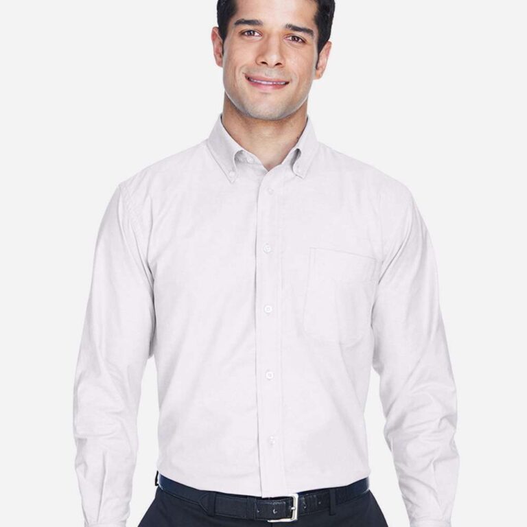 Man in white button-down shirt and navy trousers with black belt