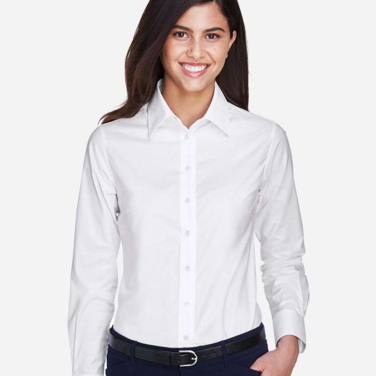Woman in white dress shirt and navy trousers with black belt