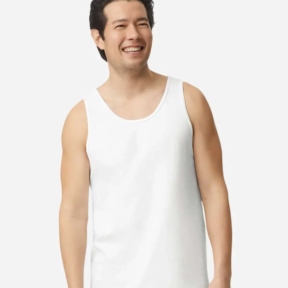 Man in a white tank top smiling
