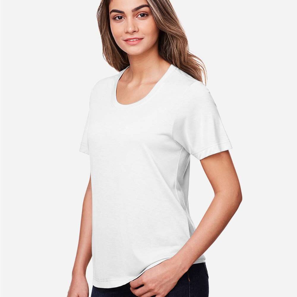 Woman in a white short-sleeve t-shirt and jeans, modelled against a white background.