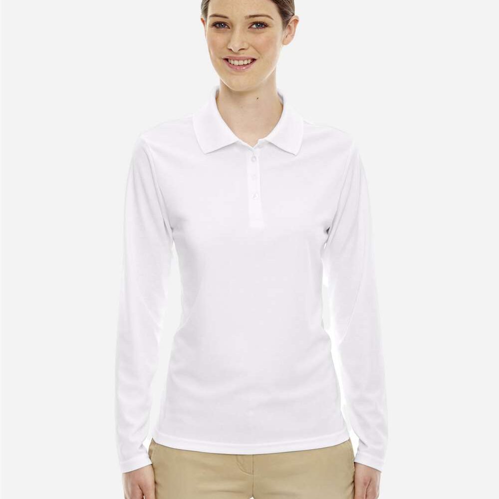 Woman wearing a white long sleeve polo shirt and tan capri pants