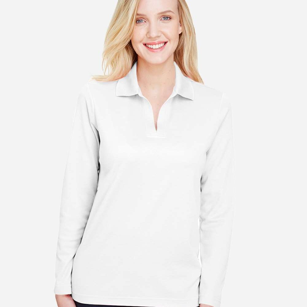 Woman smiling in a white long-sleeve polo shirt and navy pants