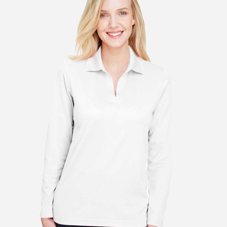 Woman smiling in a white long-sleeve polo shirt and navy pants