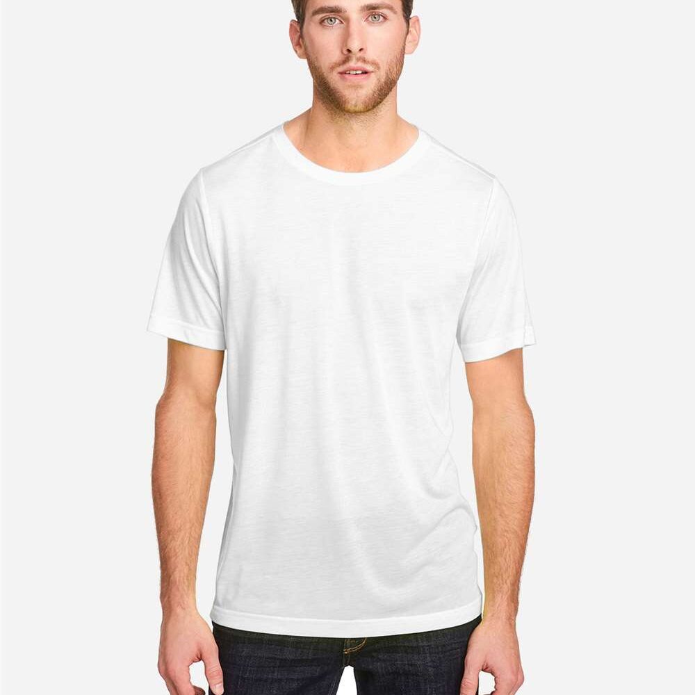 Man in a white t-shirt and dark jeans standing against a plain background.