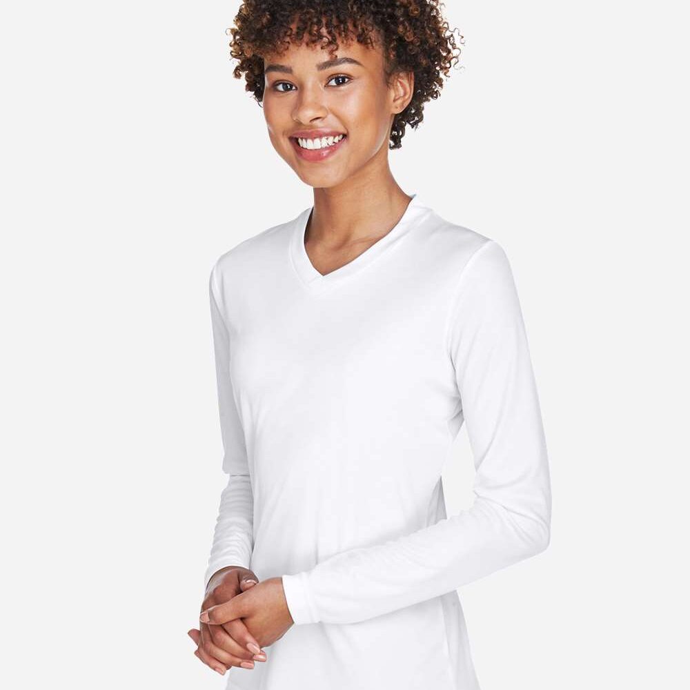 Woman wearing a white long-sleeve v-neck t-shirt.