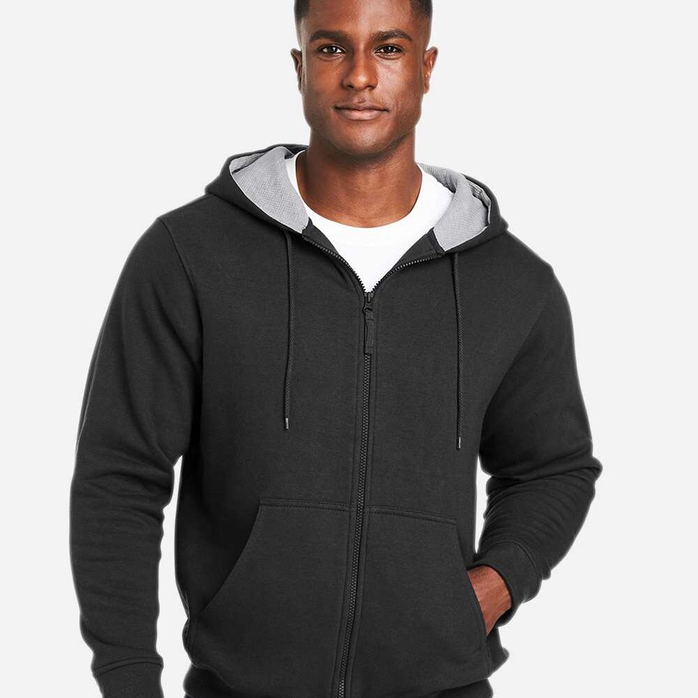Man wearing a black zip-up hoodie with a grey lined hood and a white t-shirt