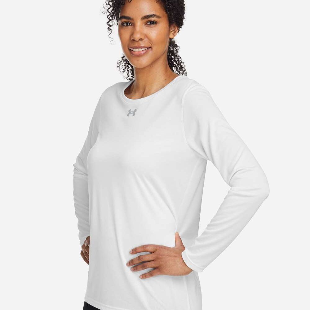 Woman in white Under Armour long sleeve shirt and black leggings