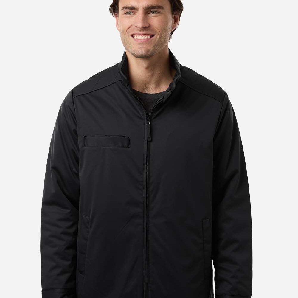 Man wearing a black zippered jacket with a chest pocket and collar