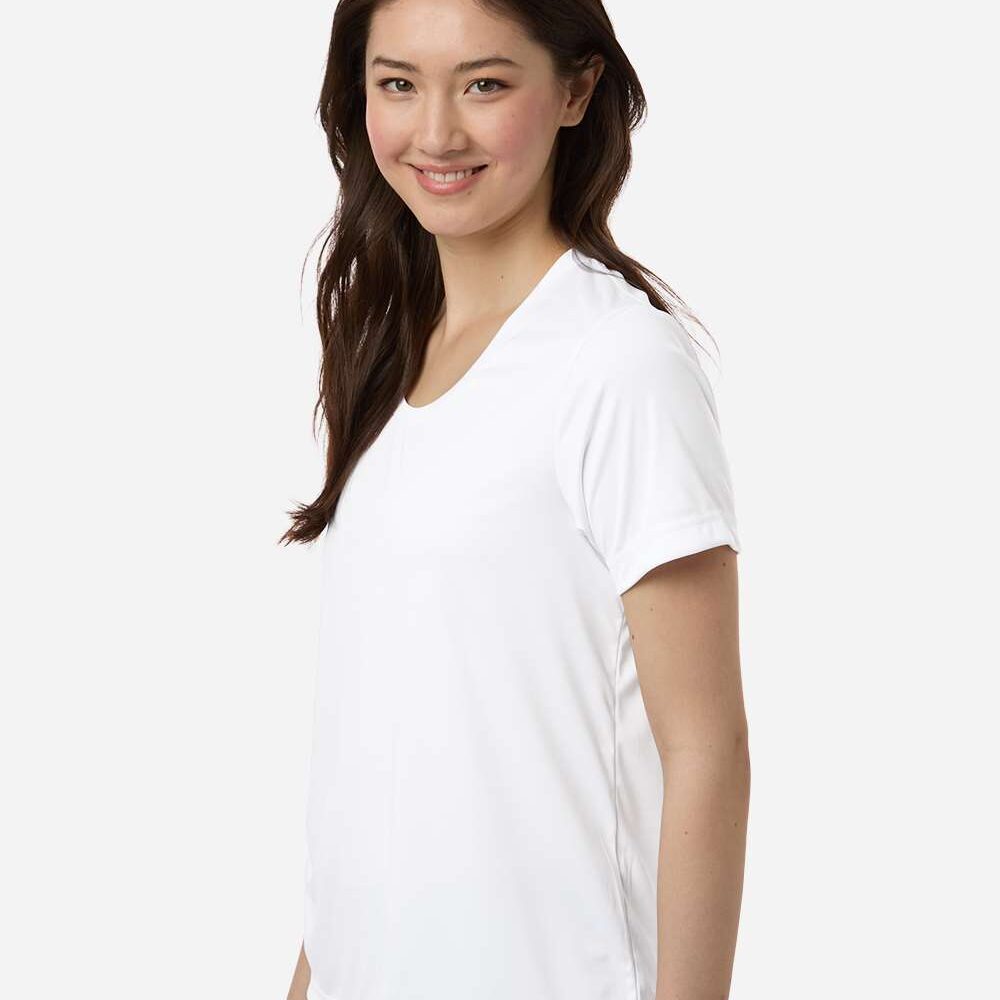 Young woman smiling in a white t-shirt