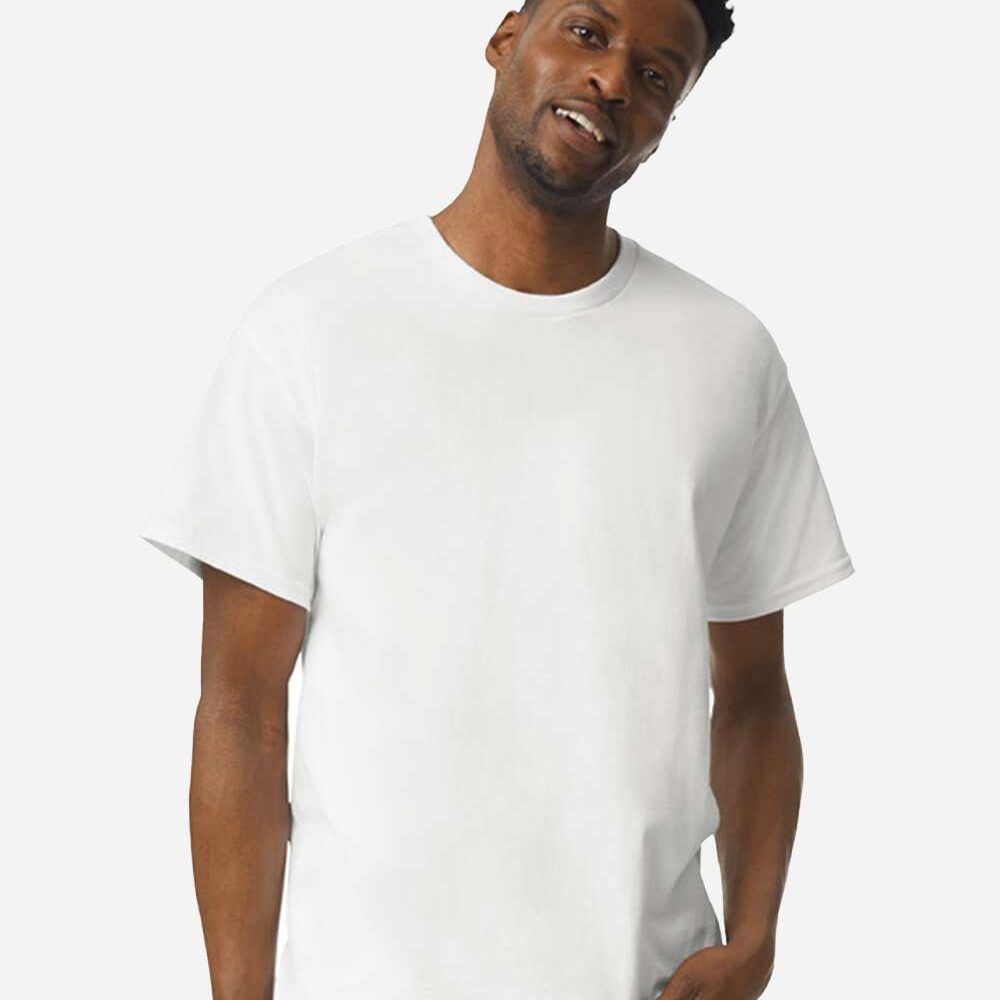 Man in a plain white t-shirt and blue jeans looking at the camera