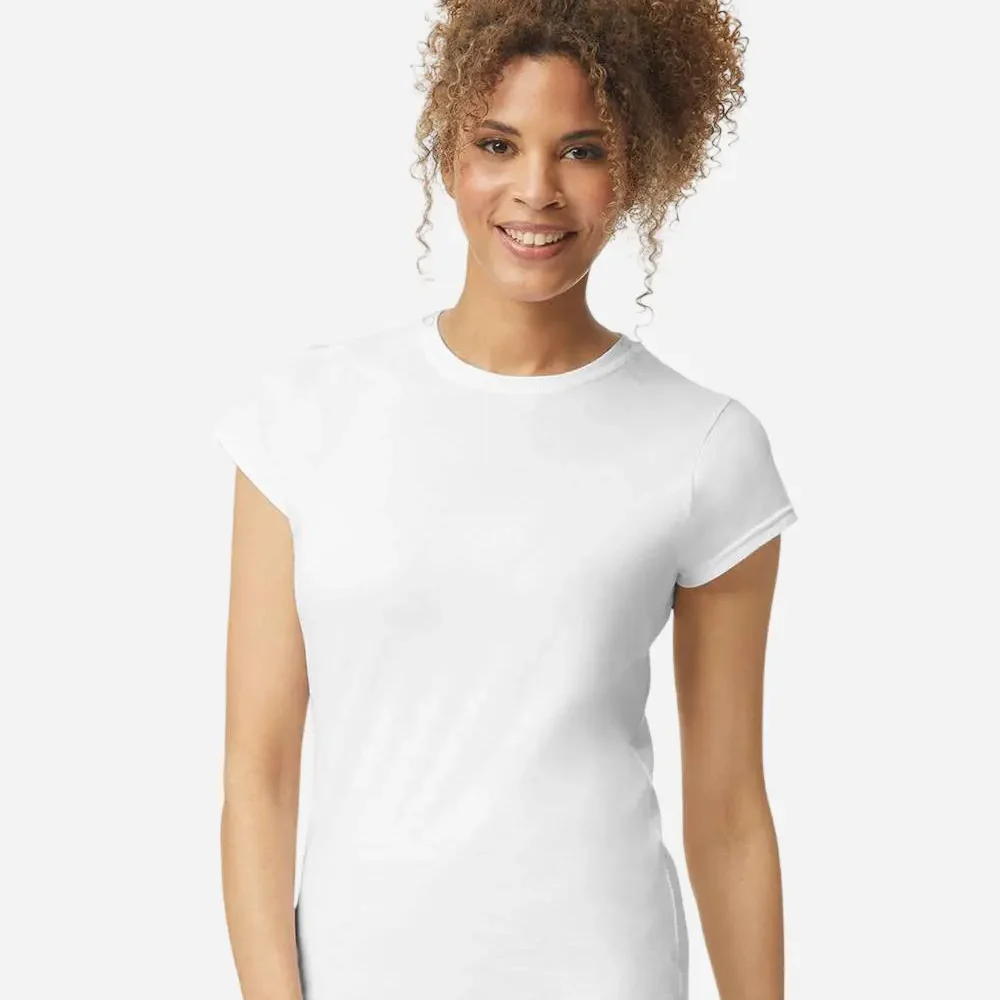 Woman wearing a plain white t-shirt, smiling, with curly brown hair