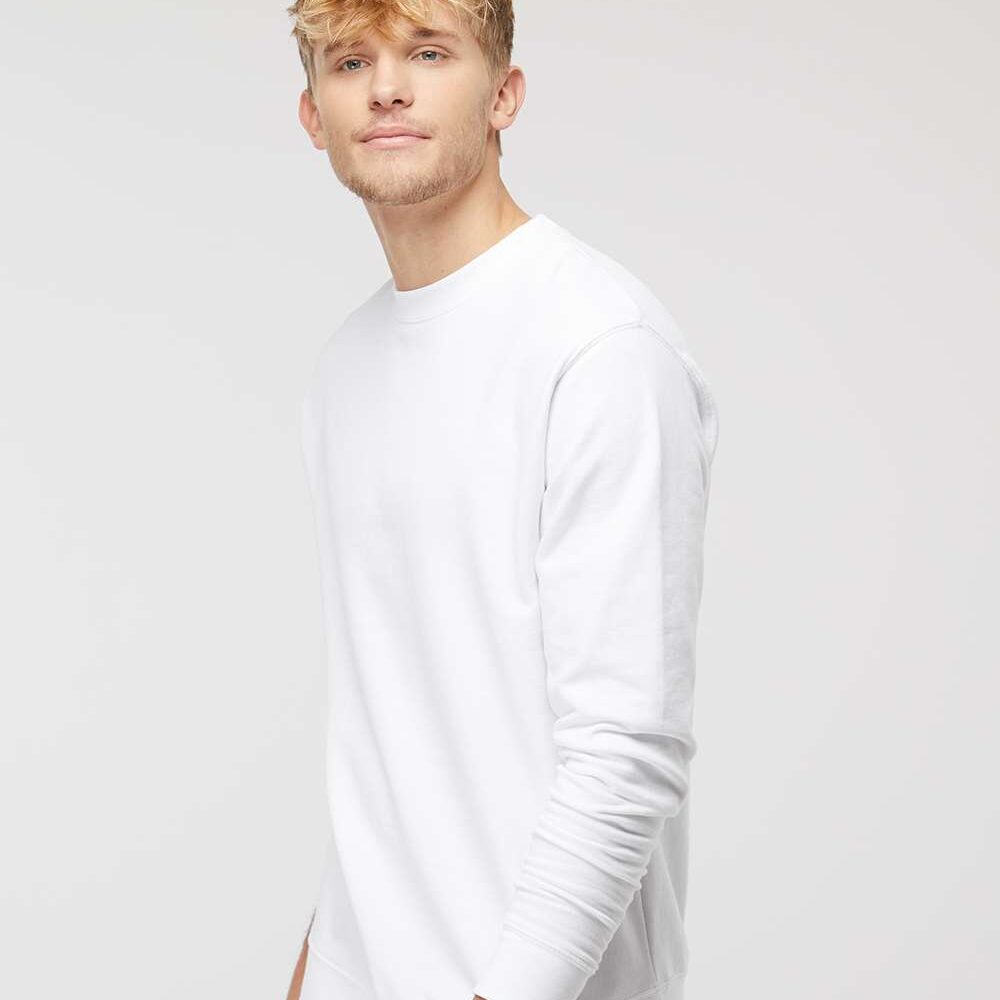 Young man with blonde hair wearing a plain white crewneck sweatshirt.