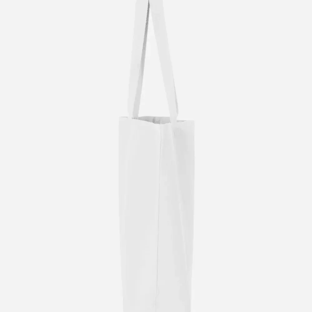 White canvas tote bag with shoulder straps, neutral background