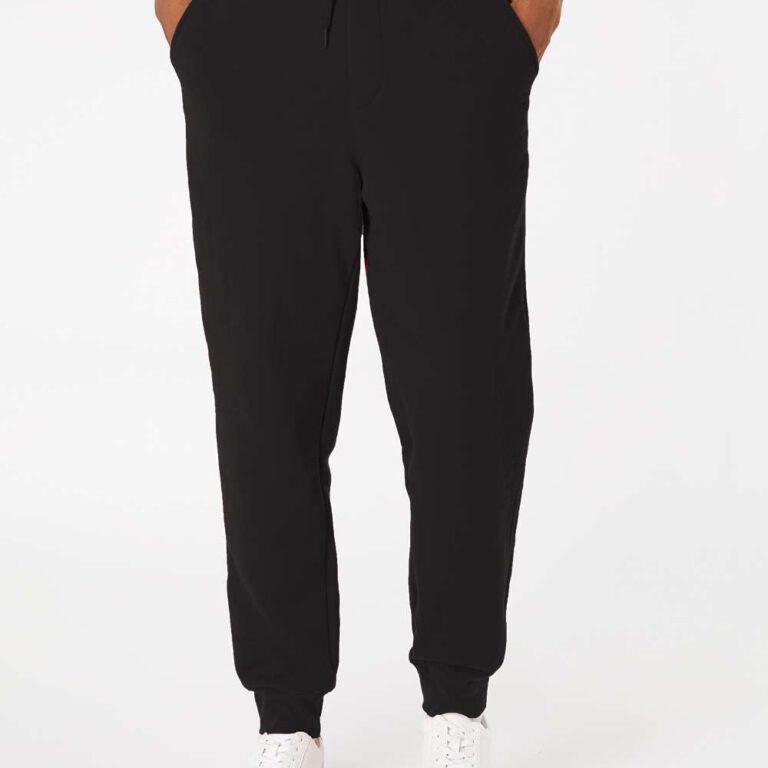 Black jogger pants with drawstring waist and white sneakers