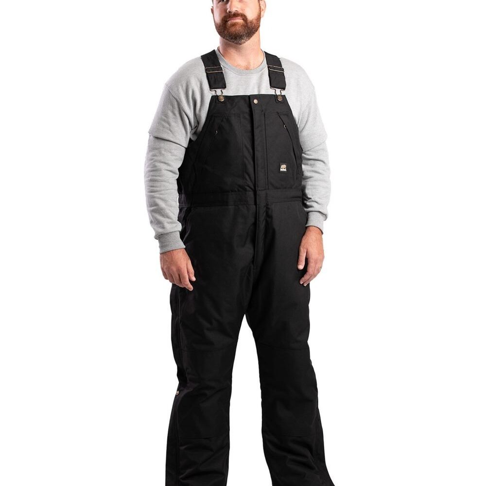 Man in black insulated bib overalls and grey sweatshirt