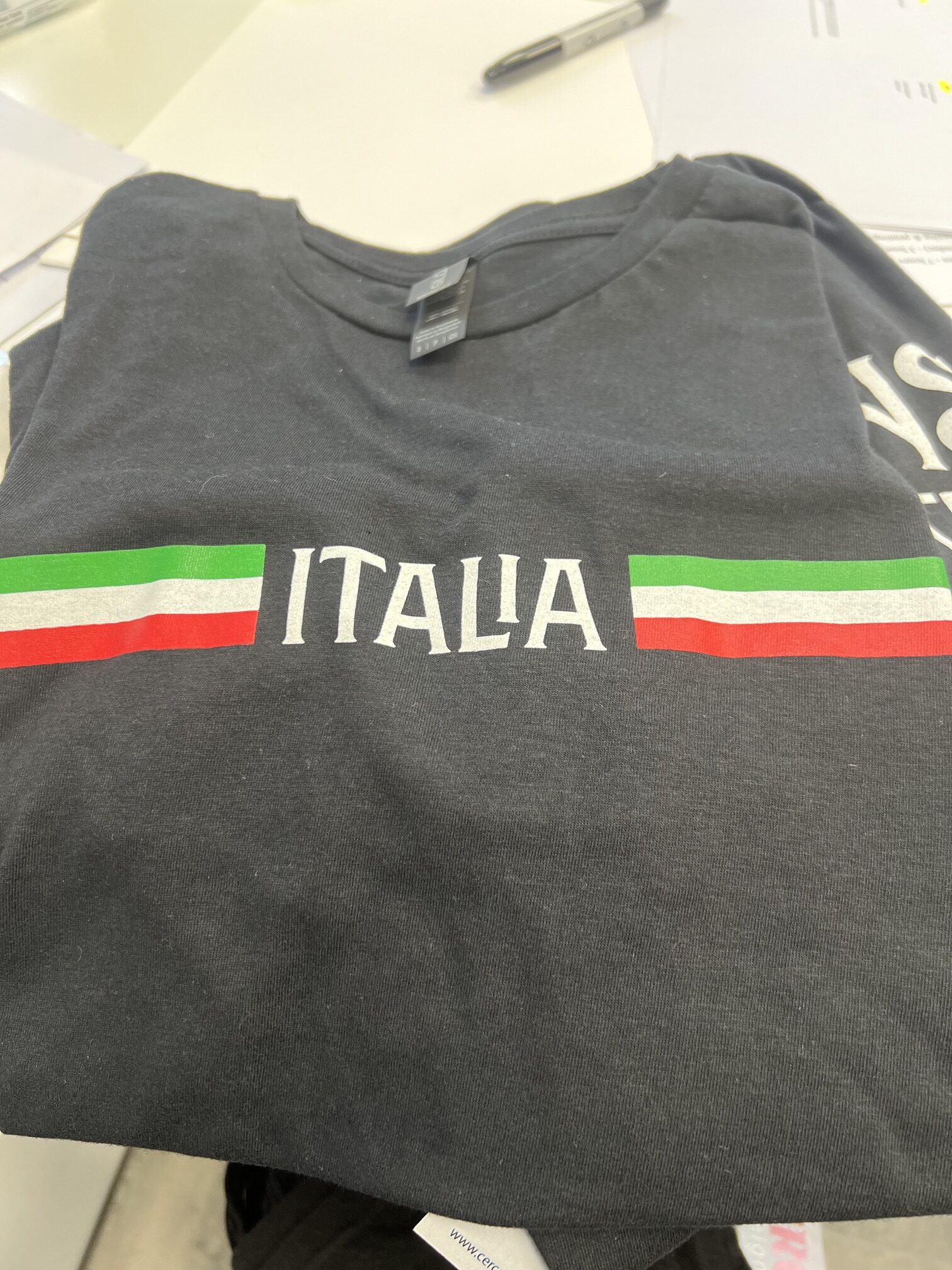 Black t-shirt with white "ITALIA" text and Italian flag stripes.